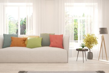 White living room with sofa and summer landscape in window. Scandinavian interior design. 3D illustration