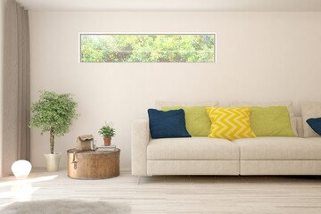 White living room with sofa and summer landscape in window. Scandinavian interior design. 3D illustration