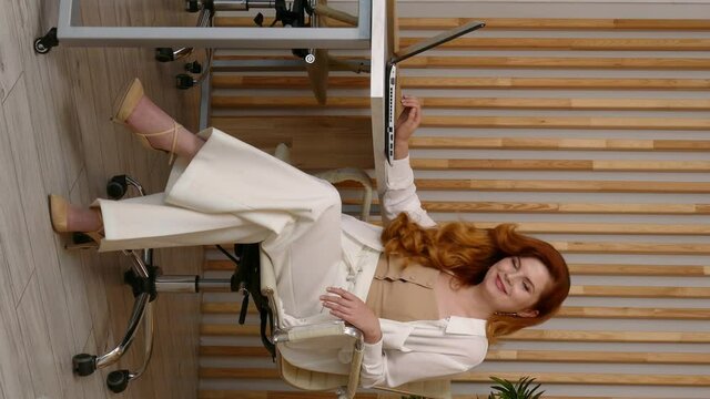 Business woman in office, Attractive Ginger.