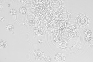 Water background. White transparent water texture, blue mint water surface with rings and ripple. Spa concept background. Flat lay, top view, copy space, copy-space, place for text.