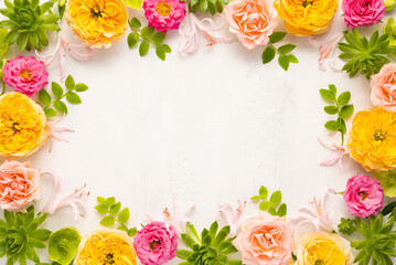 Composition of beautiful flowers, succulents and leaves on light background. Flowers frame.Top...