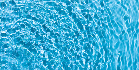 Blue Water transparent surface. Water waves,splashes, drops and ripples. Summer beauty concept.Top view. Copy space