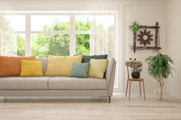 Stylish room in white color with sofa and summer landscape in window. Scandinavian interior design. 3D illustration