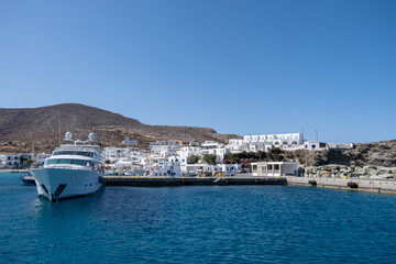 Fototapeta na wymiar Yacht moored at Karavostasi Folegandros island port. Cyclades, Greece.