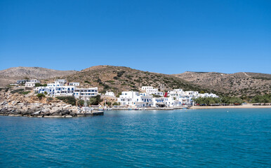 Sikinos greek island port, white buildings and blue sky background. Summer holidays at Cyclades, Greece.