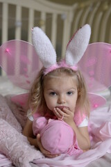 Fototapeta premium little girl with bunny ears