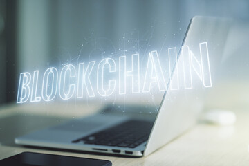 Creative abstract blockchain technology hologram on modern computer background, cryptography and decentralization concept. Multi exposure