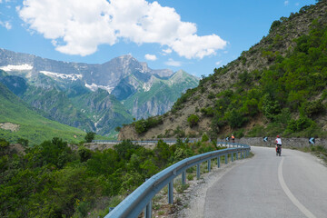 Cyclists on a winding road in Albania June 8, 2021