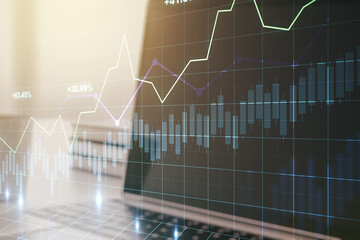 Double exposure of abstract creative financial chart on modern laptop background, research and strategy concept