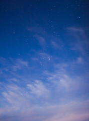 Fototapeta na wymiar blue starry sky with clouds and stars