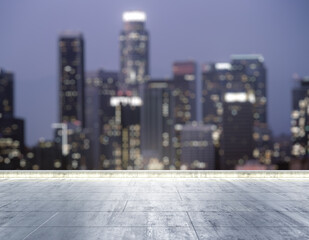 Empty concrete dirty rooftop on the background of a beautiful blurry Los Angeles city skyline at night, mockup