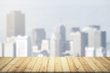 Table top made of wooden dies with blurry city view on background, template