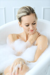 Obraz na płótnie Canvas Woman in a bathtub
