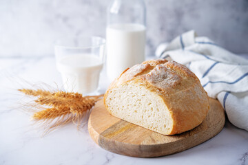 Wheat white bread with glasses of milk