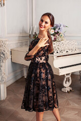 young pretty lady in black lace fashion style dress posing in rich interior of royal hotel room, luxury lifestyle people concept