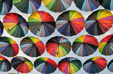 background of rainbow colored umbrellas