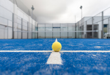 wide angle image of blue paddle tennis court without people