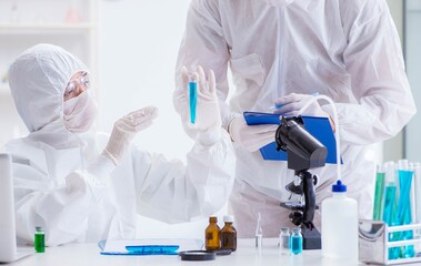 Two scientists working in the chemical lab