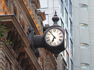 Three sided vintage clock on the Former General Post Office building now The Fullerton Hotel Sydney