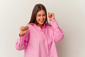 Young caucasian woman isolated on white background dancing and having fun.