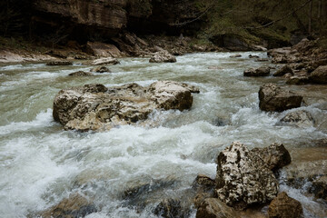 Mountain river raging waves, rocks and rocks in the river, rough water, landscape
