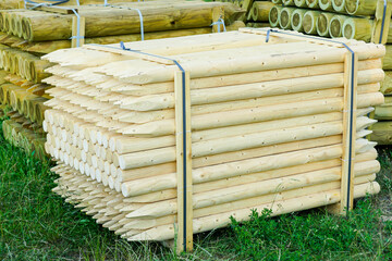 pallet with round natural wood stakes with a sharpened tip