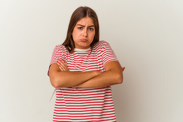 Obraz premium Young caucasian woman isolated on white background laughs joyfully keeping hands on head. Happiness concept.