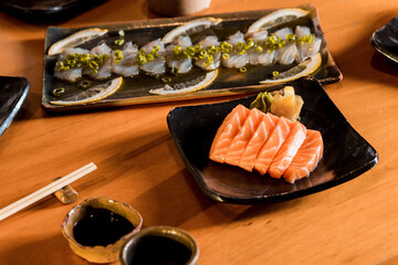 Delicious Sushi Menu Food Sashimi Salmon Tuna Shrimp Hashi Holds Gourmet Plate Restaurant Wooden Table