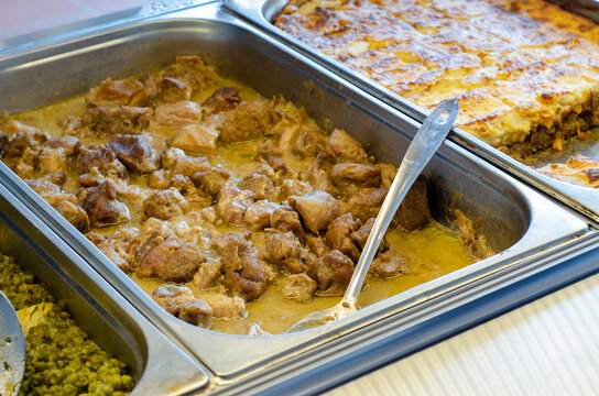 Closeup shot of lamb fricassee inside a bain-marie pot in a cafeteria