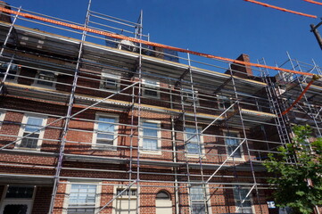 Scaffolding on Red Brick Row Homes