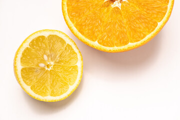 Halves of orange, lemon on white background. Top view. Composition of juicy citruses with place for text. Concept of diet, health, taste, food. Isolated. Bright light. 9x16. Copy space