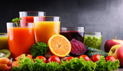 Glasses with fresh organic vegetable and fruit juices