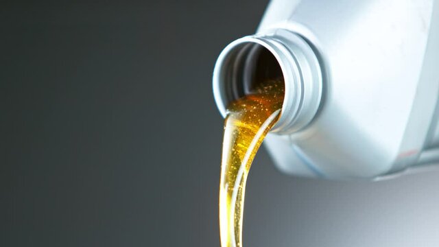 Super Slow Motion Shot of Pouring Oil from Plastic Container at 1000 fps.