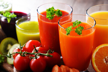 Glasses with fresh organic vegetable and fruit juices