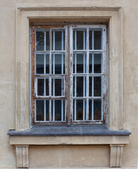 Old and beautiful antique, damaged window. Sophisticated facade, detail
