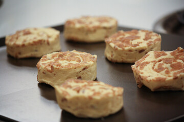 Delicious uncooked cinnamon roll on a pan waiting to be cooked 