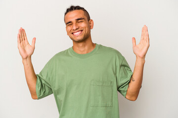Fototapeta premium Young venezuelan man isolated on white background joyful laughing a lot. Happiness concept.