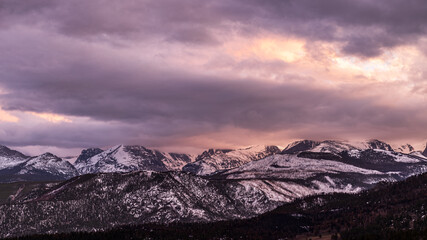 Peaceful Winter Sunset at Rocky Mountain National Park with snow-capped mountains