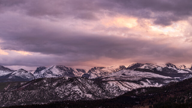 Peaceful Winter Sunset at Rocky Mountain National Park with snow-capped mountains © josephgruber