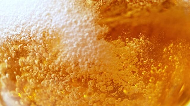 Super Slow Motion Detail Shot of Pouring Beer into Glass at 1000fps.