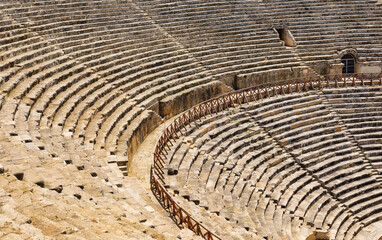 A staircase made of stone in an ancient theater. A composition without people. Ancient buildings and structures. Texture for background.