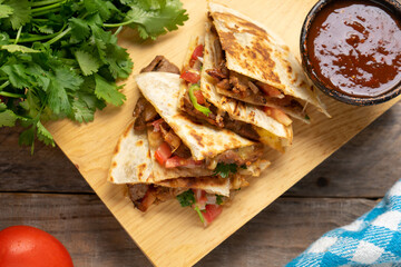 Grill steak mulitas with fresh sauce and cheese on wooden background. Mexican food