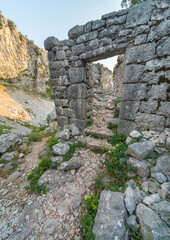 Ancient ruins near St John's church,surrounded by beautiful rocky mountain scenery at sunset, Kotor,Montenegro.