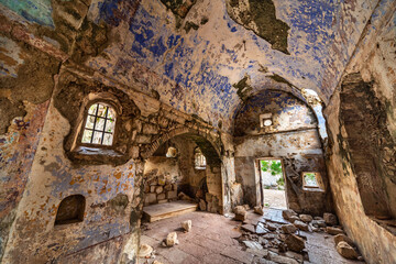 Fototapeta na wymiar Fading ancient historic frescos inside the Church of St John,Kotor,Montenegro.