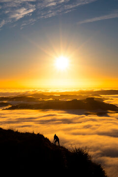 Landscape Photographer taking pictures of sunrise and morning fog atTe Mata Peak, Hawke's Bay, New Zealand
