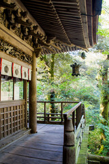 Wooden balcony of a Buddhist temple, rich in details