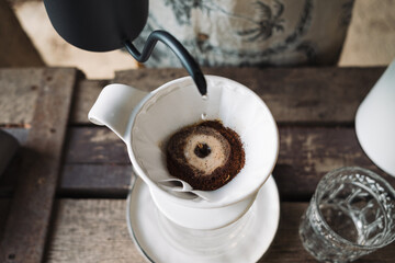 barista dripping coffee and slow coffee bar style