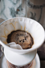 barista dripping coffee and slow coffee bar style