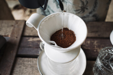 barista dripping coffee and slow coffee bar style
