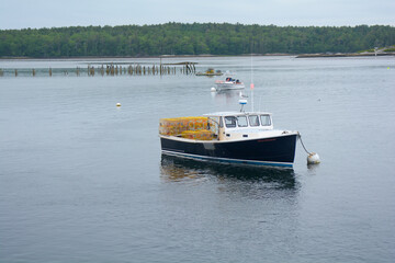 Lobster boat along the Maine coast in a bay of the Atlantic Ocean